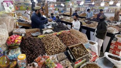 People buy dry fruits at a market in Karachi, Pakistan February 1, 2023.— Reuters