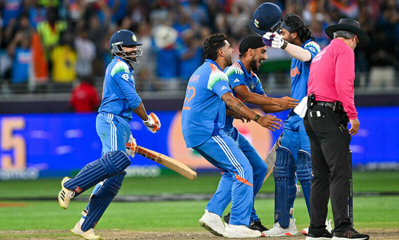 India’s players celebrate their victory during the ICC Champions Trophy one-day international (ODI) final cricket match between India and New Zealand at the Dubai International Stadium in Dubai on March 9. — AFP