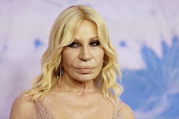 Donatella Versace out as creative director of the Milan fashion house, in a shakeup by US owner | AP News