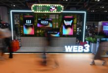 People pass by a display for the Hong Kong Web3 Festival on April 6, 2024. The city has been pushing to become a virtual asset hub. Photo: Matt Haldane