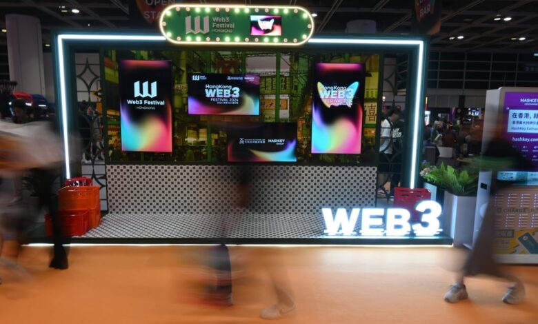 People pass by a display for the Hong Kong Web3 Festival on April 6, 2024. The city has been pushing to become a virtual asset hub. Photo: Matt Haldane