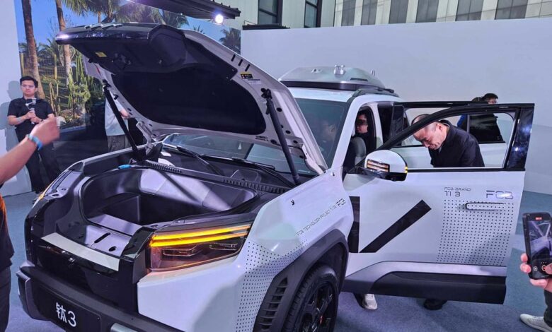 Visitors at the Titanium 3 launch event look check out the new SUV. Photo: Coco Feng