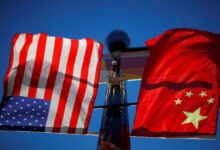 The flags of the United States and China fly from a lamppost in the Chinatown neighbourhood of Boston, Massachusetts, US, November 1, 2021. — Reuters
