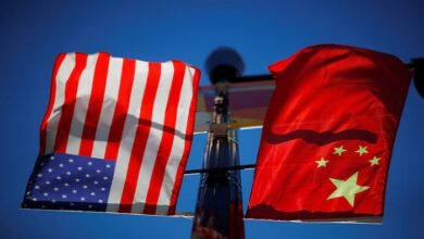 The flags of the United States and China fly from a lamppost in the Chinatown neighbourhood of Boston, Massachusetts, US, November 1, 2021. — Reuters