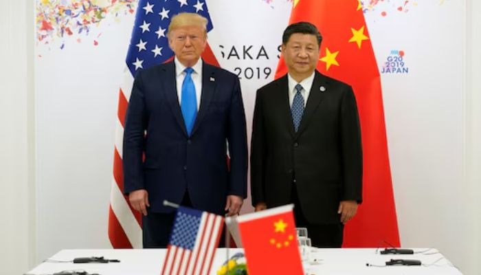 US President Donald Trump (R) and Chinas President Xi Jinping pose for a photo ahead of their bilateral meeting during the G20 leaders summit in Osaka, Japan, June 29, 2019. — Reuters