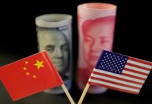 U.S. and Chinese flags are seen in front of a U.S. dollar banknote featuring American founding father Benjamin Franklin and a Chinese yuan banknote featuring late Chinese chairman Mao Zedong in this illustration picture taken May 20, 2019. — Reuters