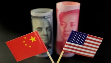 U.S. and Chinese flags are seen in front of a U.S. dollar banknote featuring American founding father Benjamin Franklin and a Chinese yuan banknote featuring late Chinese chairman Mao Zedong in this illustration picture taken May 20, 2019. — Reuters
