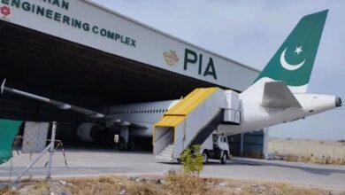 This picture, released on February 9, 2023, shows a Pakistan International Airlines (PIA) aircraft parked inside a shade in Nur Khan Engineering Complex in Islamabad. — X/@PIA