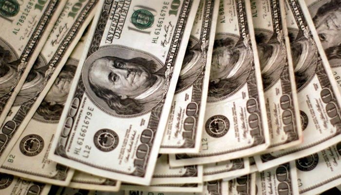 An undated image of freshly printed dollar bills in a mint. — Reuters