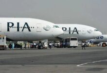 Pakistan International Airlines (PIA) aircraft are parked on the runway. — AFP/File