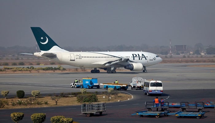 A Pakistan International Airlines (PIA) plane prepares to take off at Alama Iqbal International Airport in Lahore, February 1, 2012. — Reuters