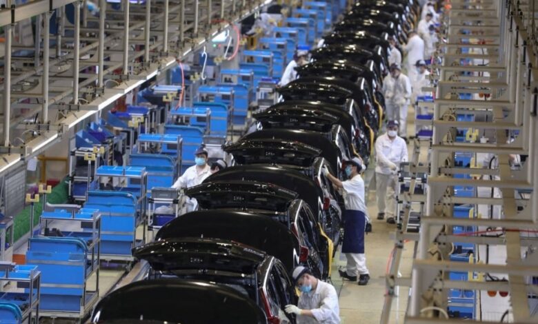 The representational image shows employees assembling cars at Dongfeng Honda’s plant in Wuhan, central Hubei province. — AFP/File