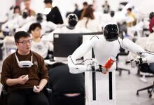 Staff members train humanoid robots at AgiBot’s data collection centre in Shanghai. Photo: China News Service/VCG via Getty Images