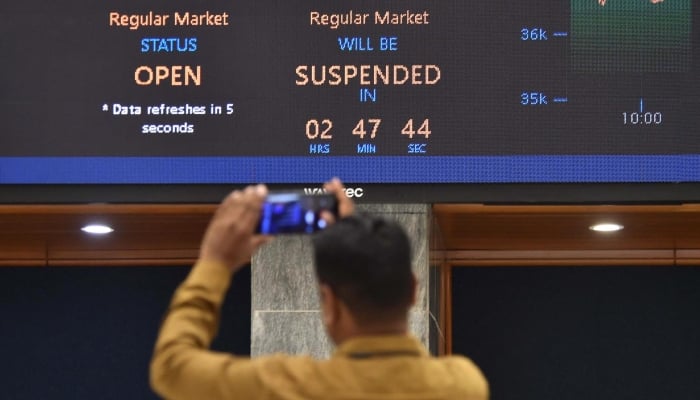 A stockbroker monitors stock prices at the Pakistan Stock Exchange (PSX) in Karachi, Pakistan, April 07, 2025. — INP