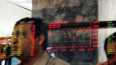 A stock trader views the performance of shares on a trading screen at PSX.— Reuters/File
