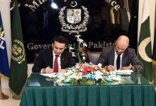 Pakistan Crypto Council CEO Bilal Bin Saqib and a representative from World Liberty Financial sign an agreement in Islamabad on April 26. — Ministry of Finance