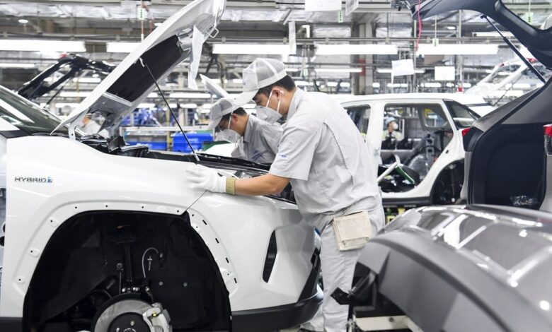 Chinese workers assemble Toyota vehicles at a plant in Changchun, northeast Jilin province. Photo: Costfoto/Future Publishing via Getty Images
