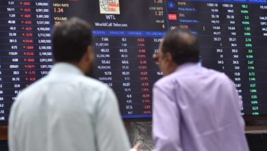 Stockbrokers monitor stock prices at the Pakistan Stock Exchange in Karachi on April 7, 2025. — INP