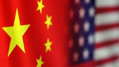 The image shows China and US flags. — Reuters/File