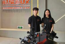 Guangdong Crownpower Electric Power Technology Development’s Jacky Yu Mingjie, left, and Aria Li Yuxin with the firm’s lead wire connection robot. Photo: Coco Feng