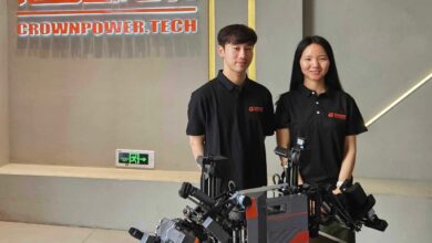 Guangdong Crownpower Electric Power Technology Development’s Jacky Yu Mingjie, left, and Aria Li Yuxin with the firm’s lead wire connection robot. Photo: Coco Feng