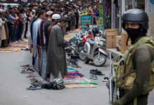 Kashmiri Muslims offer Friday prayers on a road as a security personnel stands guard, in Srinagar, May 2, 2025. — Reuters