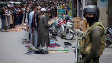 Kashmiri Muslims offer Friday prayers on a road as a security personnel stands guard, in Srinagar, May 2, 2025. — Reuters