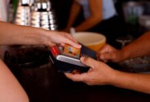 This representational image shows a woman paying with a credit card at a restaurant in Playa del Ingles, Maspalomas on the island of Gran Canaria, Spain, May 3, 2022. — Reuters
