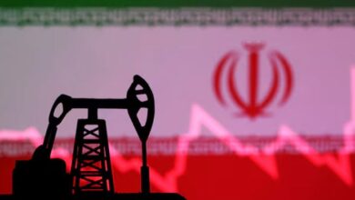 Iranian flag with stock graph and an oil pump jack miniature model are seen in this illustration taken October 9, 2023. — Reuters