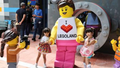 Children pose for a photo with a mascot as they visit Legoland Shanghai Resort ahead of the theme park’s opening on July 5. Photo: Reuters