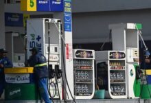 Employees at a fuel station wait for customers in Islamabad on February 16, 2022. — AFP