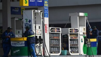 Employees at a fuel station wait for customers in Islamabad on February 16, 2022. — AFP