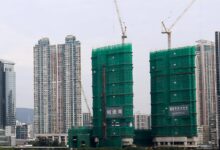 The Deep Water Pavilia luxury residential project, wrapped in green mesh, is being built by a consortium led by New World Development. Photo: Dickson Lee