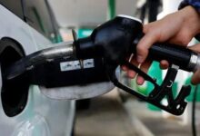 Representational image shows a person using a fuel nozzle to fuel up a car at a petrol station in Vienna, Austria March 18, 2022. — Reuters