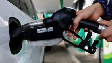 Representational image shows a person using a fuel nozzle to fuel up a car at a petrol station in Vienna, Austria March 18, 2022. — Reuters