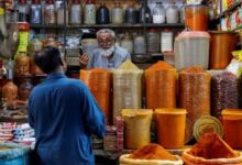 A shopkeeper speaks with a customer while selling spices at a market in Karachi, Pakistan June 11, 2024.— Reuters