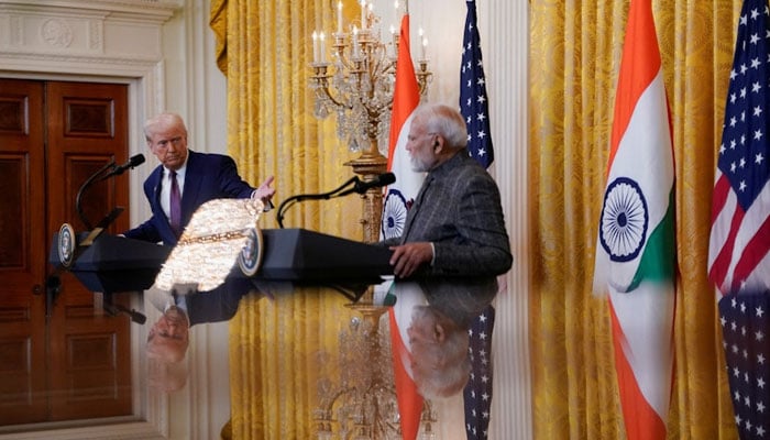 US President Donald Trump and Indian Prime Minister Narendra Modi are pictured in a mirror as they attend a joint press conference at the White House in Washington, DC, US, February 13, 2025. — Reuters